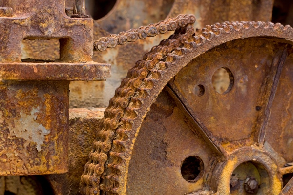 Molecular machines, like proteins, are damaged by oxidative stress.  These damaged machines don't work as well as they're supposed to.  